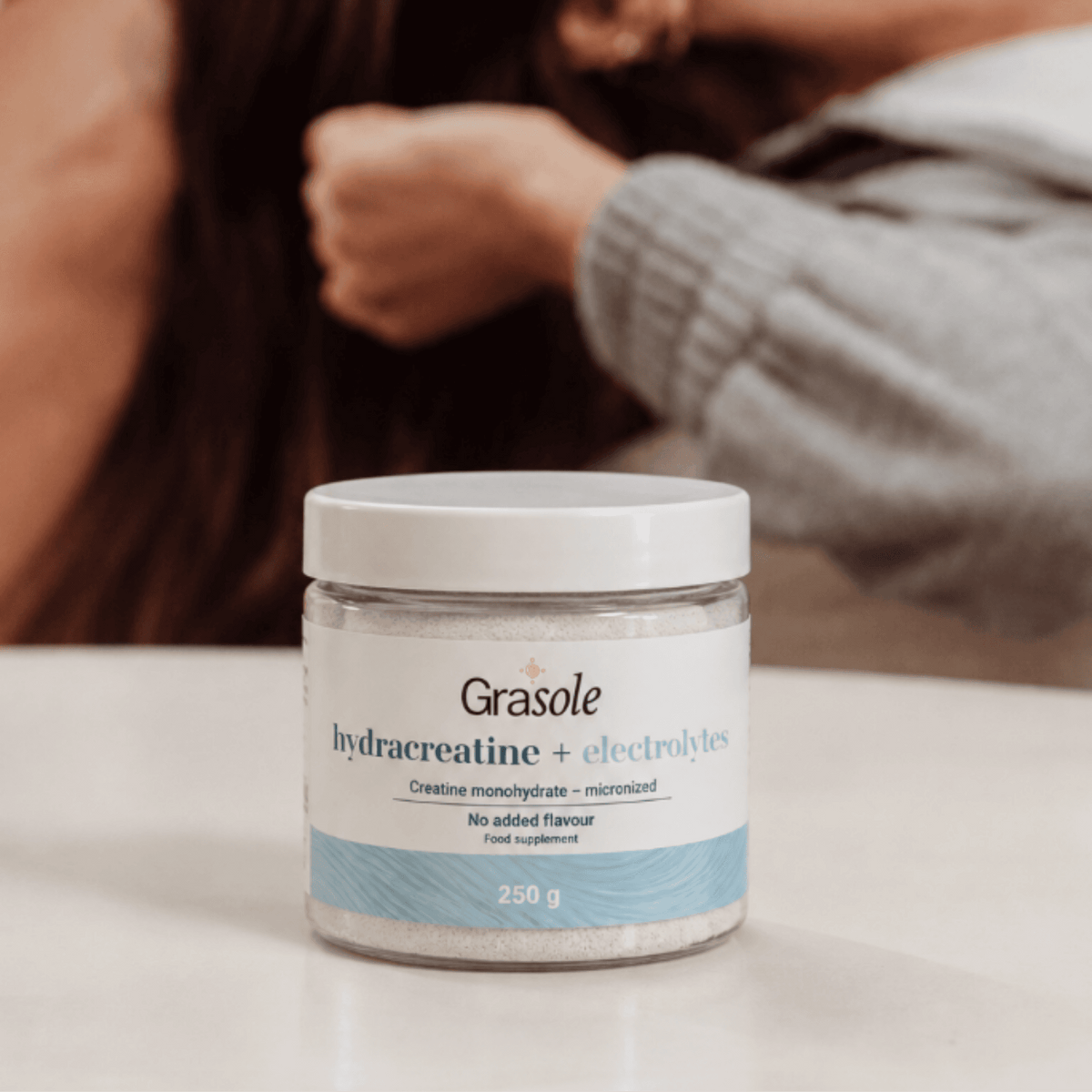 GraSole unflavoured Hydracreatine tub held in a hand
